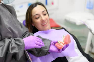 Orthodontist explaining braces treatment timeline to patient