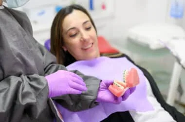 Orthodontist explaining braces treatment timeline to patient